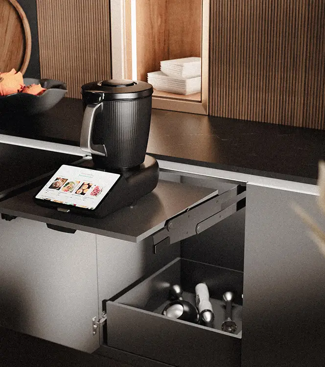 Drawer interior fitted with custom inserts for utensils and small appliance storage